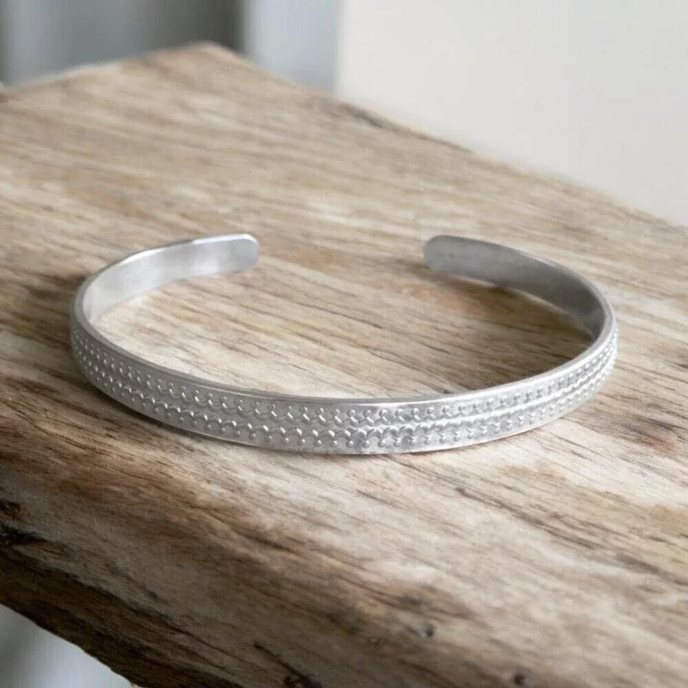 Brushed sterling silver scalloped open cuff bangle bracelet with satin finish.